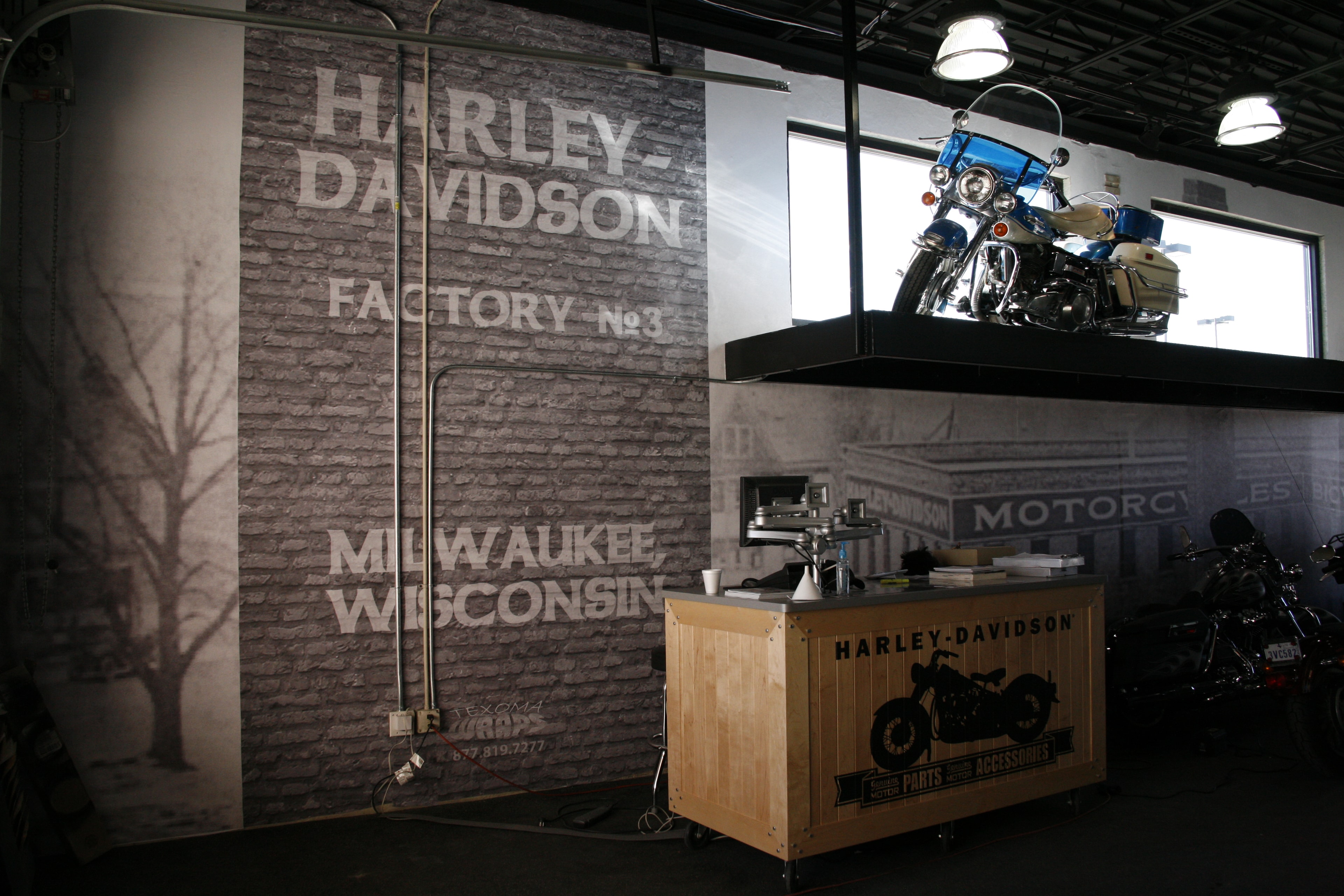 Harley-Davidson dealership showroom wall wrap with Milwaukee Wisconsin factory branding by Architectural Wraps