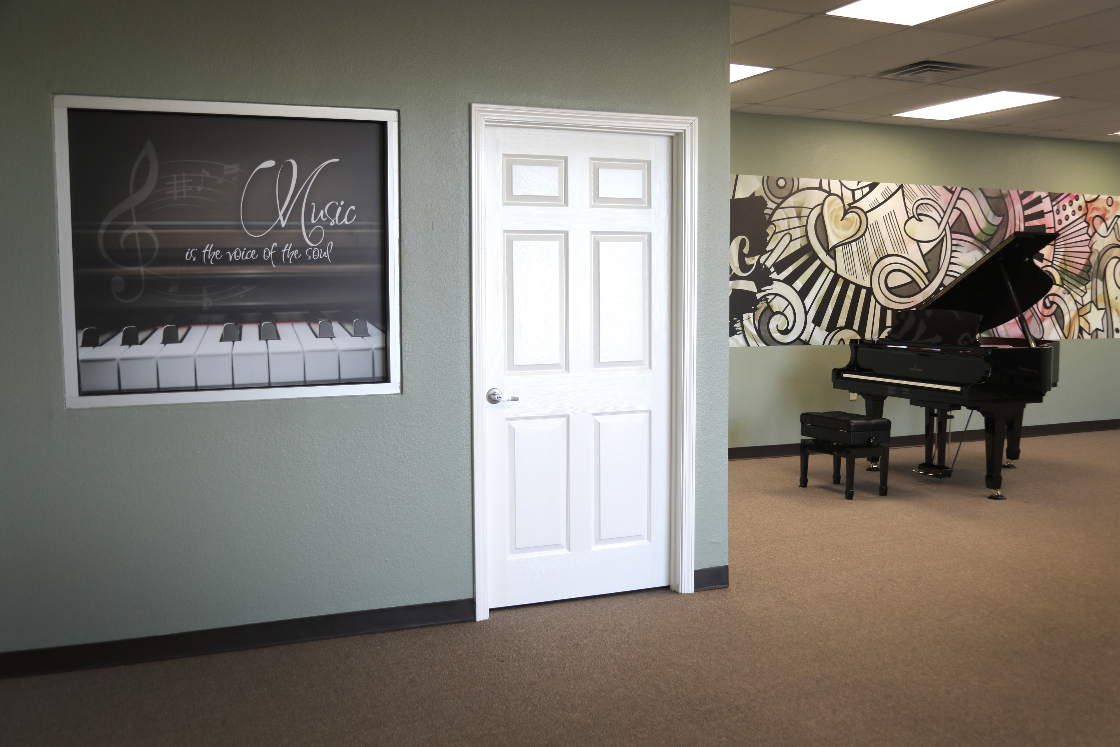 Music studio wall art installation with piano graphic and colorful mural by Architectural Wraps