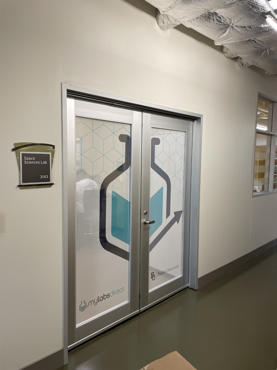 MyLabs Direct Baylor University Space Sciences Lab door window wrap with branded graphics by Architectural Wraps