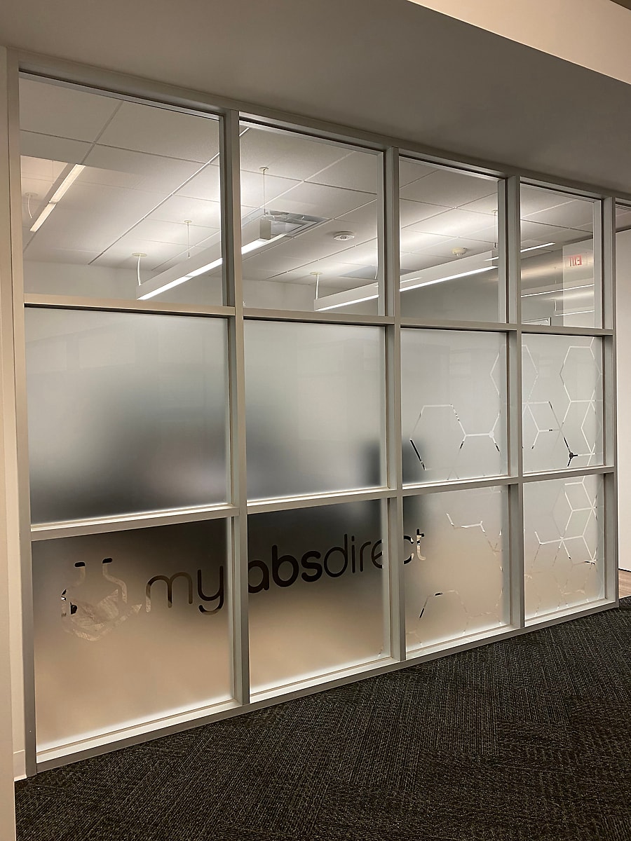 MyLabs Direct office frosted glass partition wall with logo and hexagon pattern by Architectural Wraps