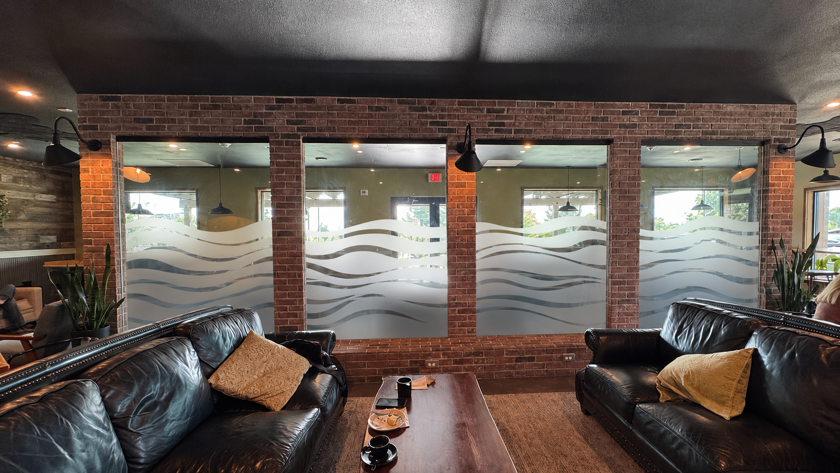 Restaurant lounge brick wall frosted glass windows with wave pattern privacy film by Architectural Wraps
