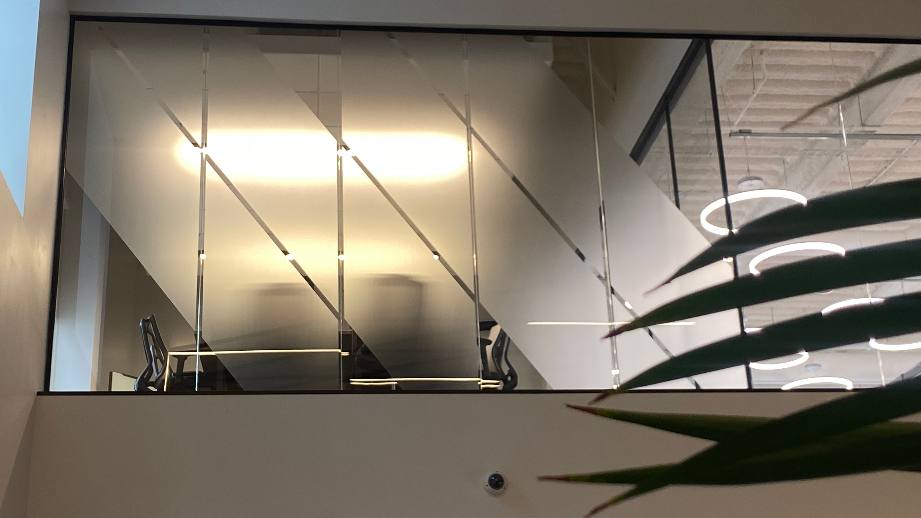 Vari office mezzanine glass partition with diagonal stripe decorative window film by Architectural Wraps