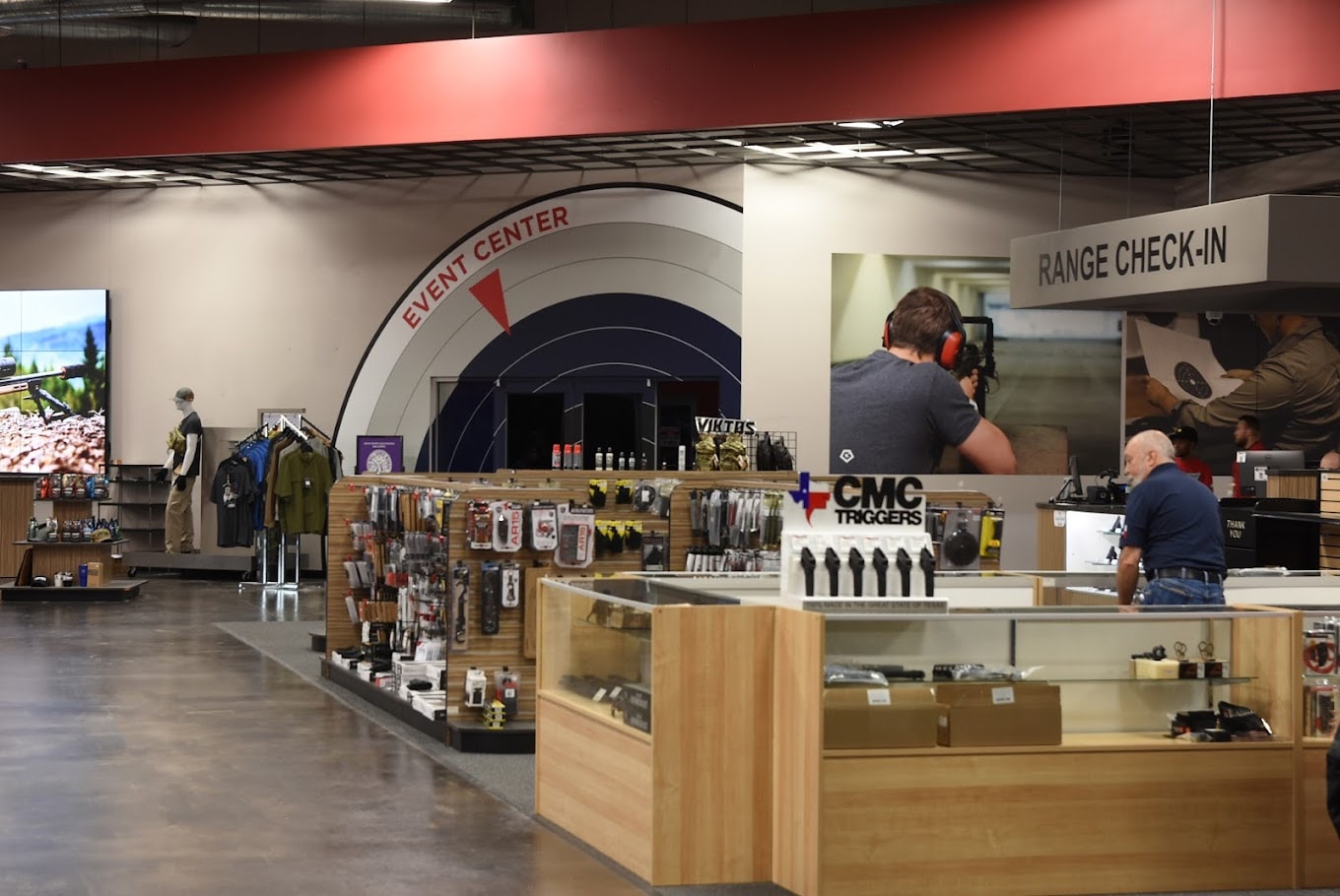 Indoor shooting range event center bullseye wall graphic and range check-in branded environment by Architectural Wraps