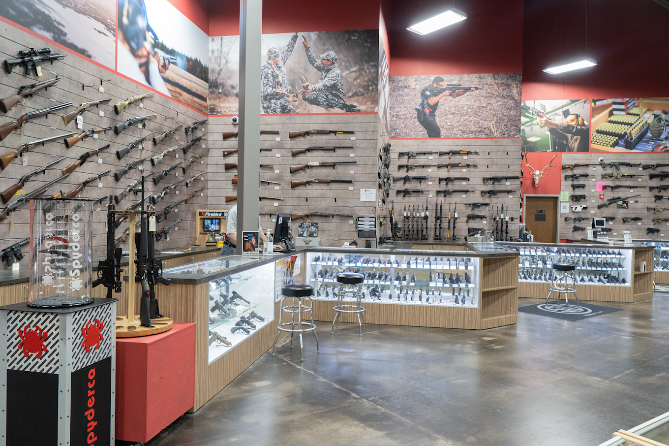 GRITR Outdoors firearms retail store full branded environment with large-format hunting wall murals by Architectural Wraps