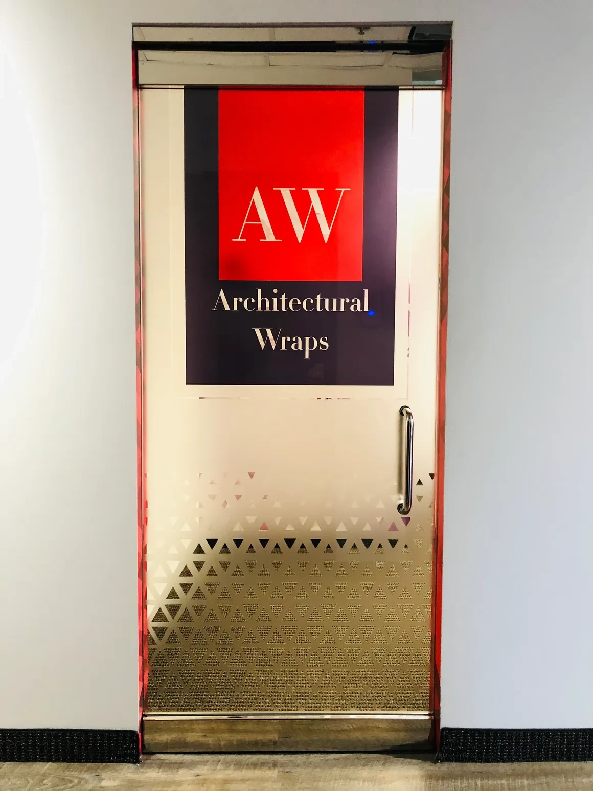 Architectural Wraps office door printed frosted vinyl with AW logo and geometric triangle pattern by Architectural Wraps