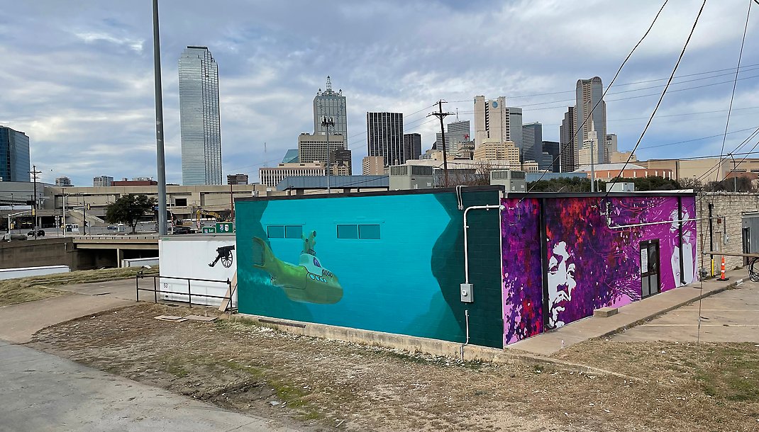 Exterior building wrap installation downtown Dallas TX by Architectural Wraps commercial graphics