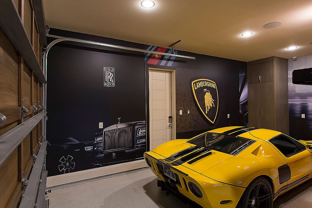 Custom luxury car garage wall mural with Rolls Royce and Lamborghini branding by Architectural Wraps